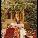 perkins-victor-004-reading-paper-under-tropical-canopy_Wondershare
